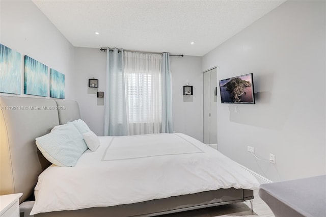 bedroom featuring a textured ceiling