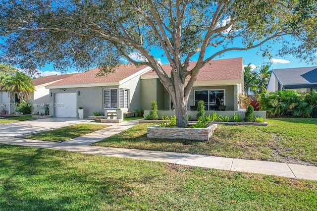 single story home with a garage and a front lawn