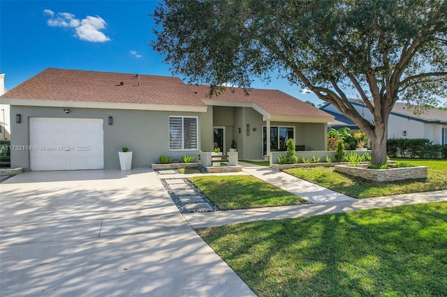 single story home with a garage and a front yard