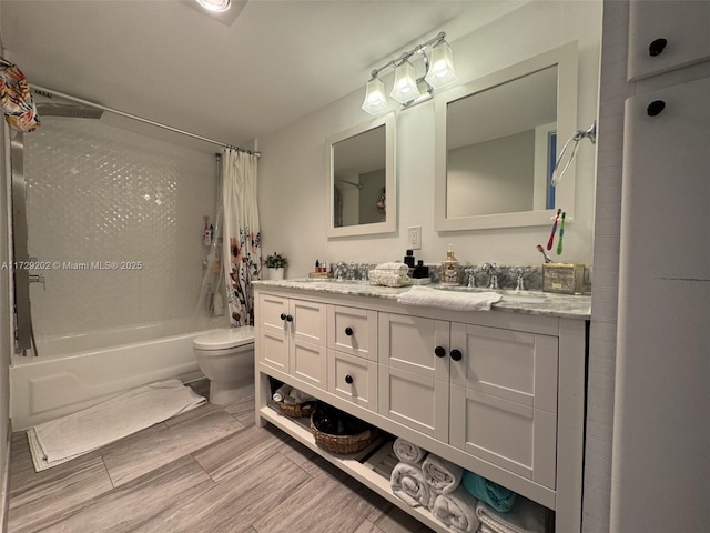 full bathroom with vanity, toilet, and shower / bath combo with shower curtain