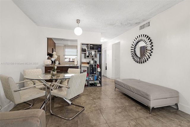 dining area with a textured ceiling