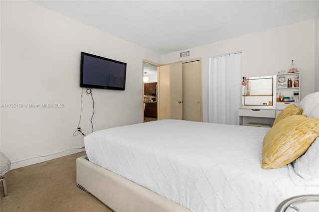 carpeted bedroom featuring a closet