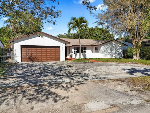 ranch-style house featuring a garage