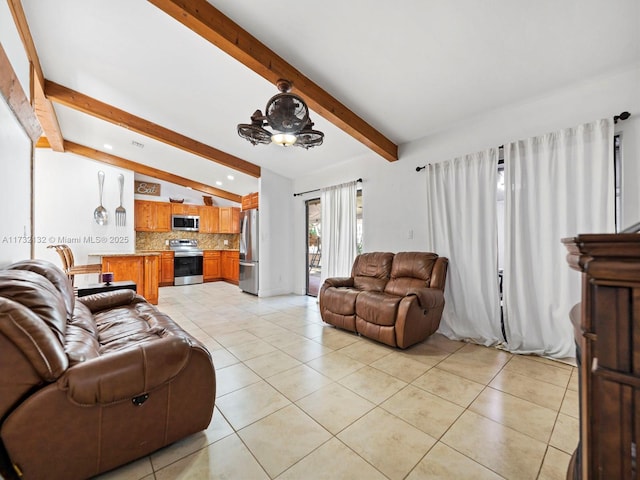 living room featuring light tile patterned floors and lofted ceiling with beams