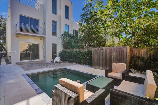 view of swimming pool featuring a patio area