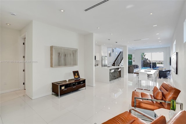 living room with light tile patterned floors