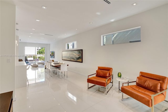 living area with light tile patterned floors