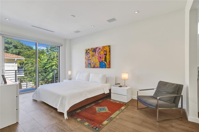 bedroom with hardwood / wood-style floors