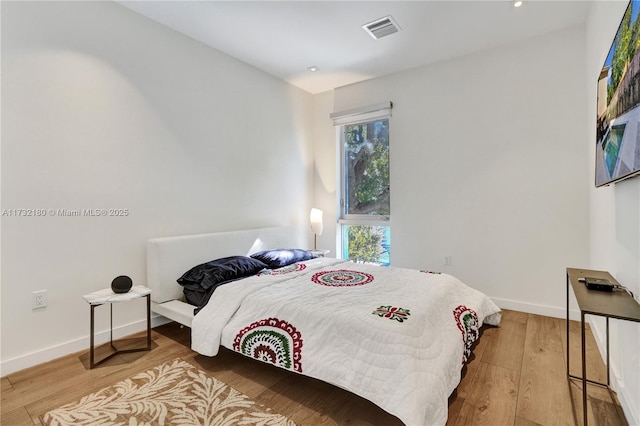 bedroom with light hardwood / wood-style flooring