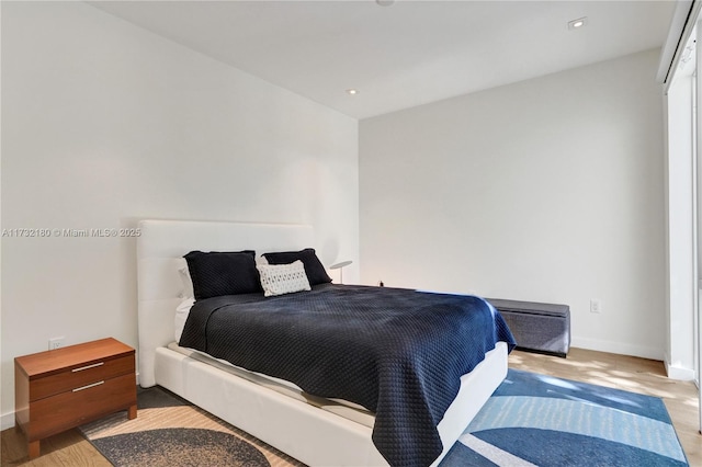 bedroom with light wood-type flooring