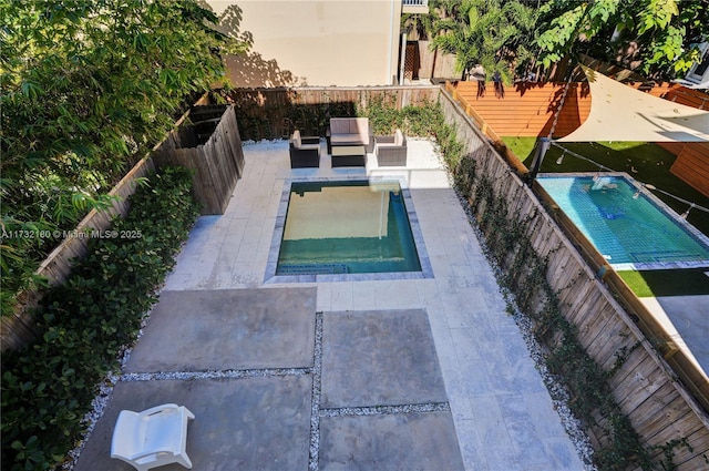 view of swimming pool with a patio