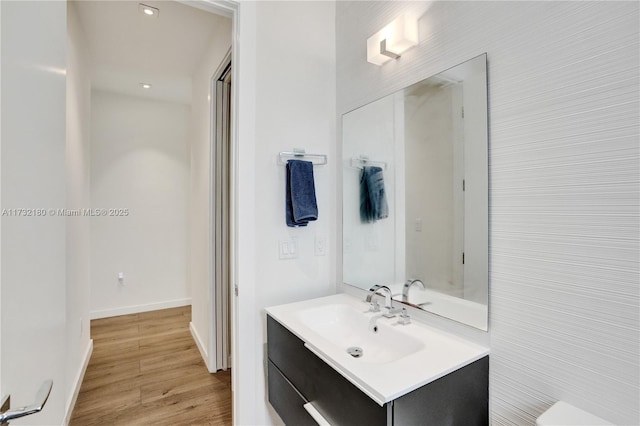 bathroom with vanity and hardwood / wood-style floors