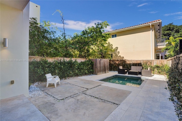 view of swimming pool featuring an outdoor hangout area and a patio