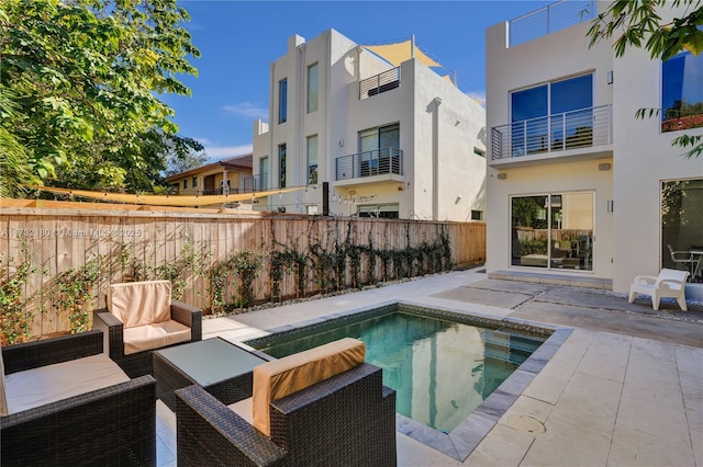 view of pool with outdoor lounge area and a patio area