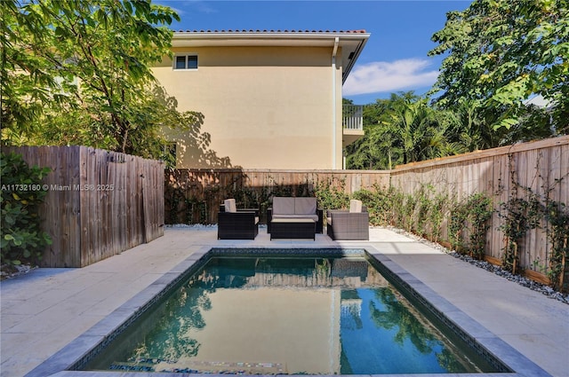 view of swimming pool featuring outdoor lounge area and a patio