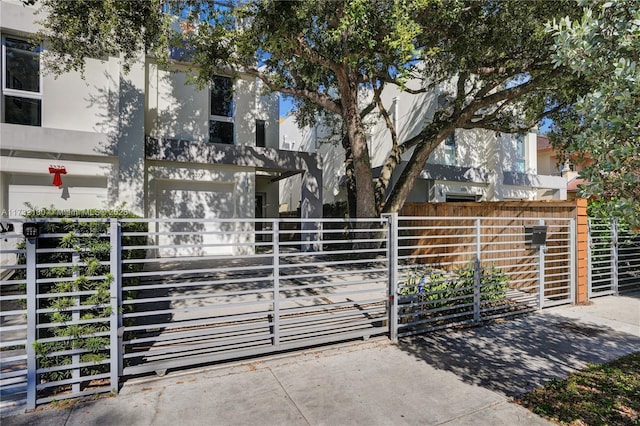 view of gate featuring a garage