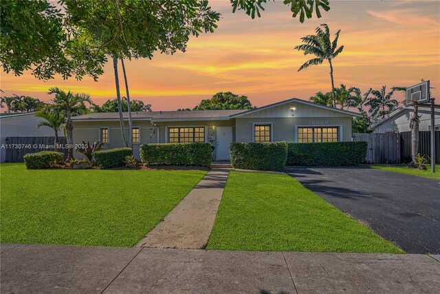 single story home featuring a front yard