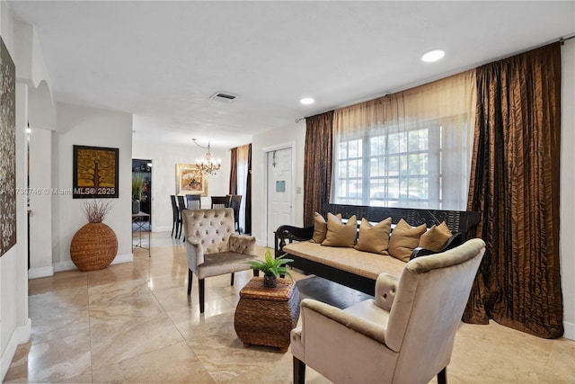 living room with an inviting chandelier