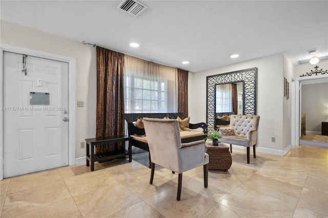 living area featuring light tile patterned floors