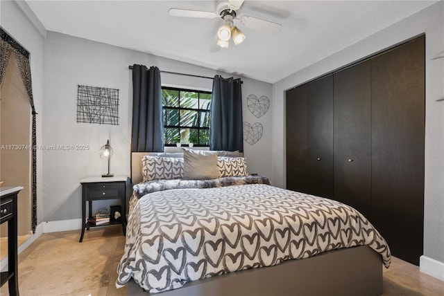 bedroom with ceiling fan and a closet