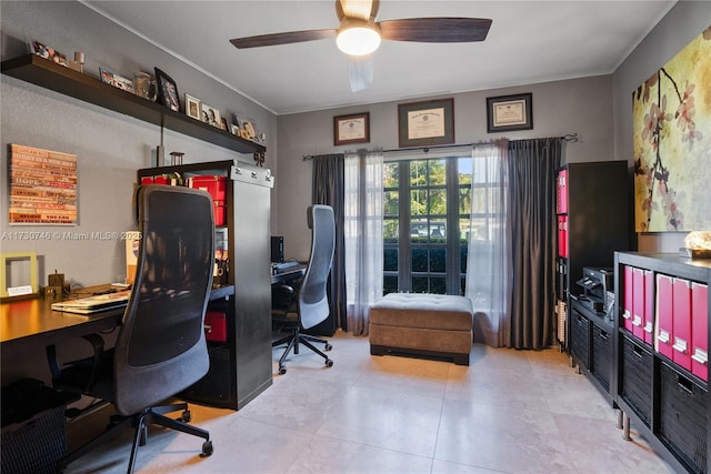 office area with light tile patterned floors and ceiling fan