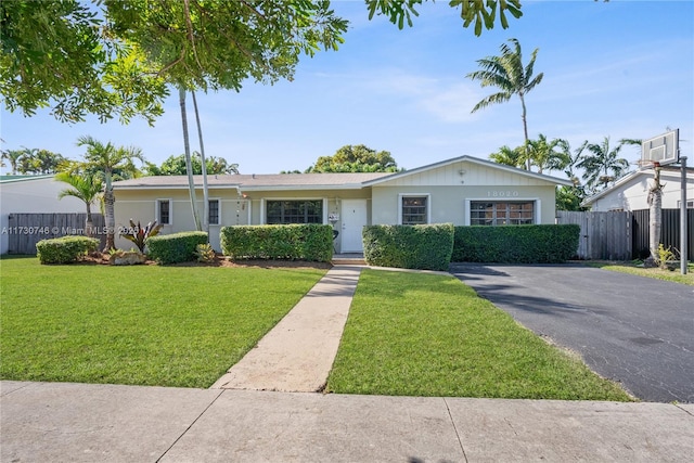 ranch-style house with a front lawn