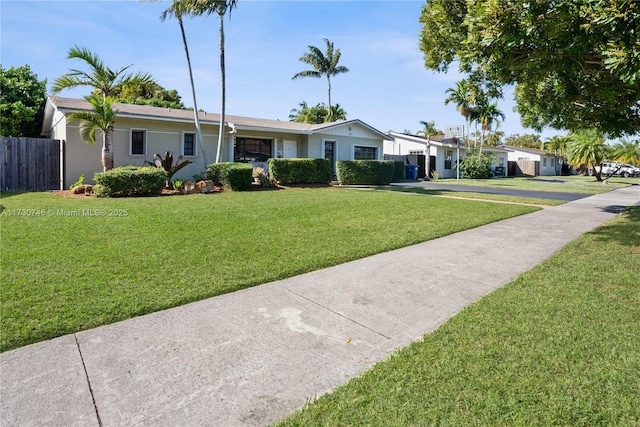 single story home featuring a front yard