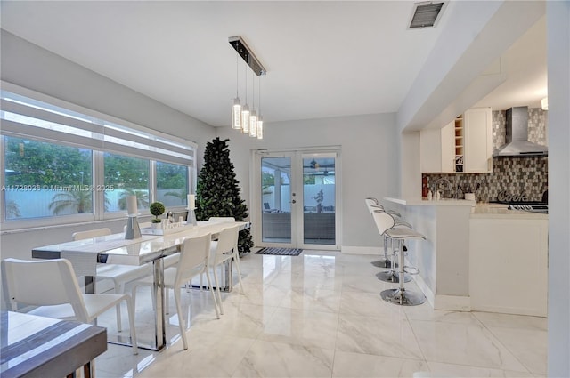 dining area with french doors and sink