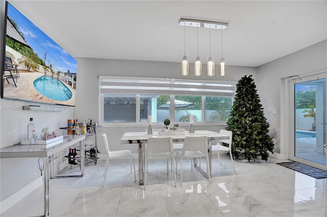 dining space with a healthy amount of sunlight