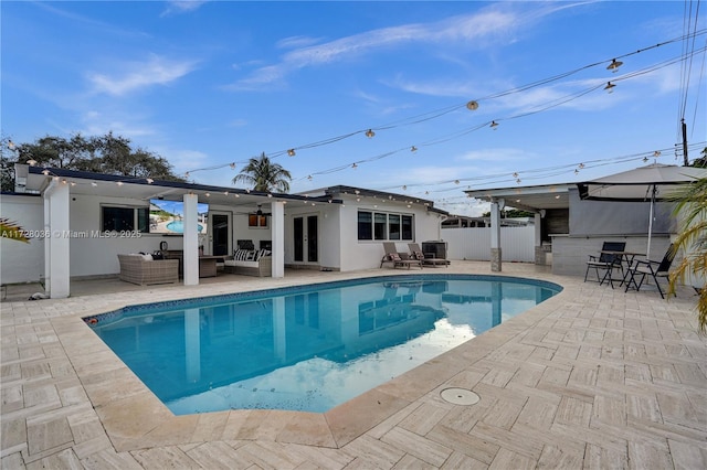 view of pool with ceiling fan, an outdoor hangout area, central AC unit, and a patio