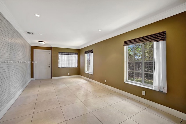 interior space featuring ornamental molding and brick wall