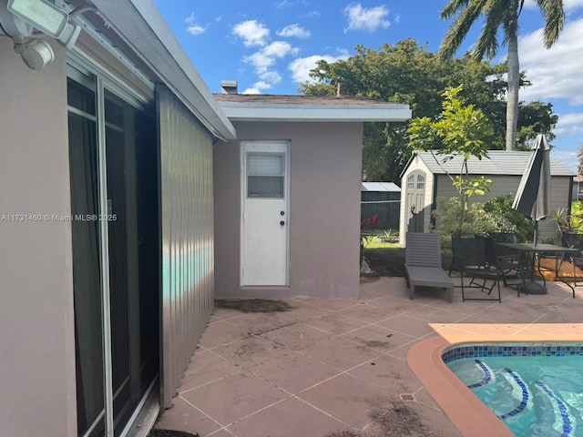 view of swimming pool with a patio