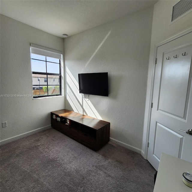 unfurnished living room with carpet flooring