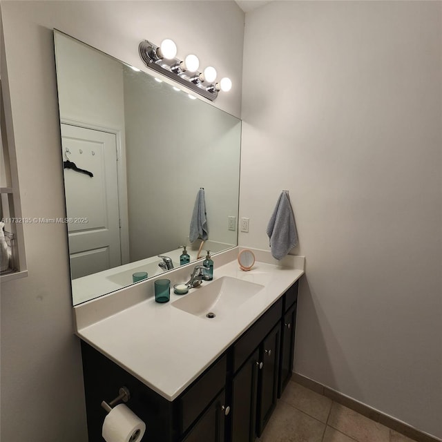 bathroom with tile patterned flooring and vanity