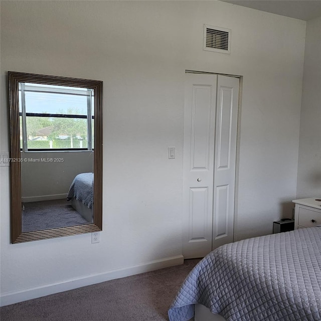 carpeted bedroom featuring a closet