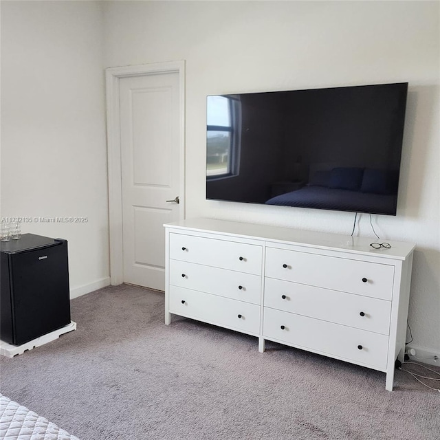 unfurnished bedroom featuring light colored carpet