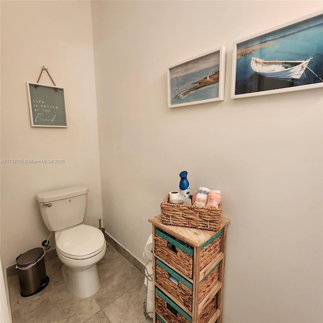 bathroom with tile patterned floors and toilet