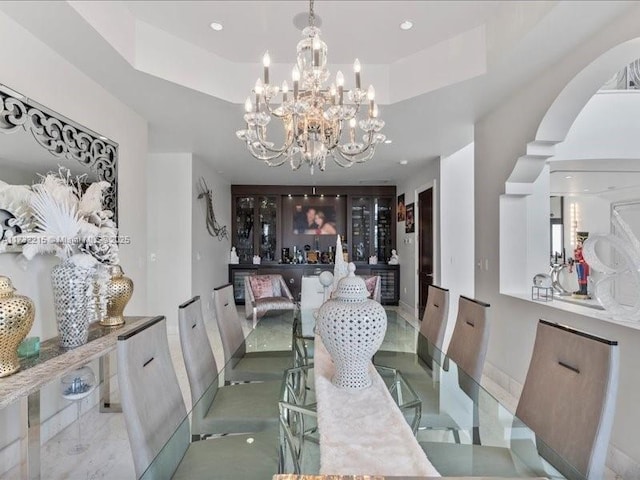 dining area with a tray ceiling