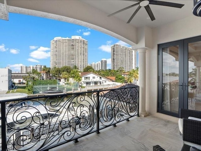 balcony with french doors and ceiling fan