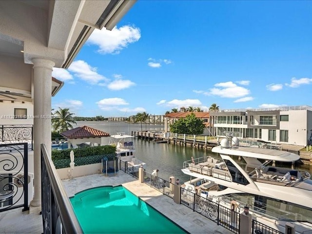 exterior space with a water view and a patio area