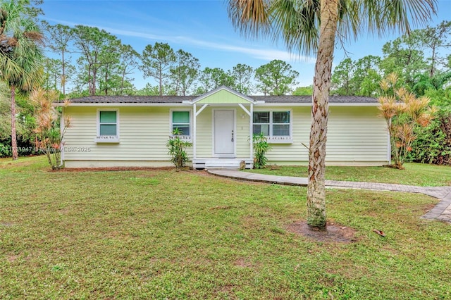 single story home featuring a front yard