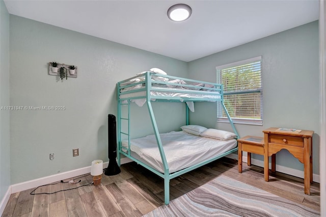 bedroom featuring wood-type flooring