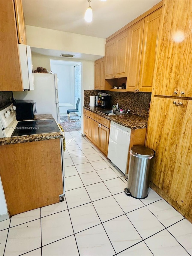 11780 SW 18th St Unit 510-2, Miami, FL 33175 - kitchen with decorative backsplash, white appliances, a sink, and light tile patterned floors