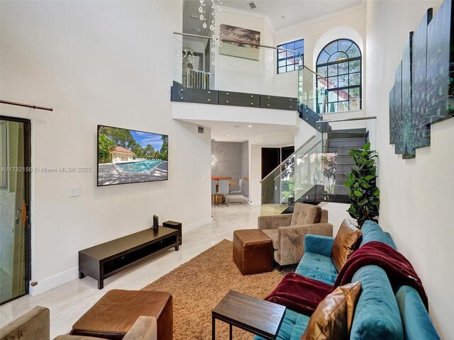 living room featuring light tile patterned flooring and a high ceiling