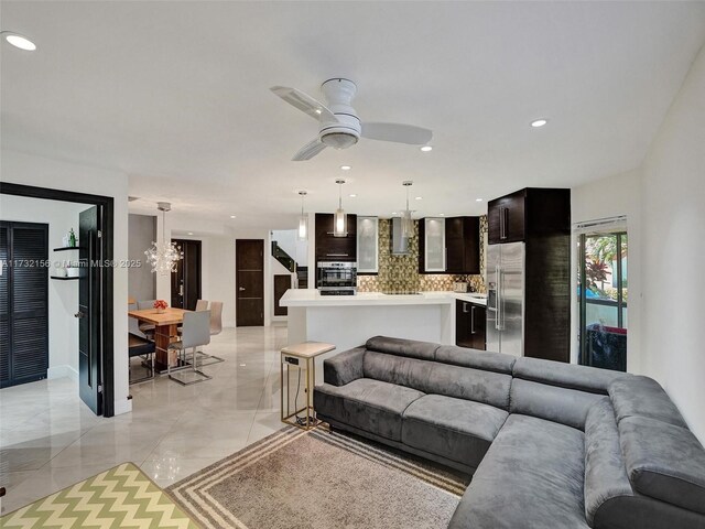 living room with light tile patterned floors and ceiling fan