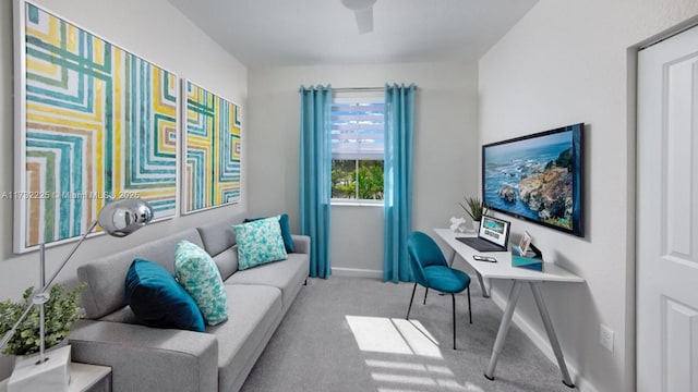 carpeted office with ceiling fan