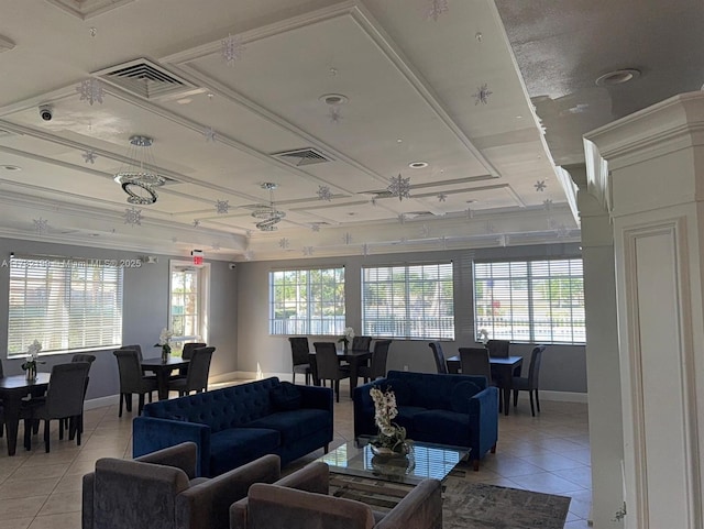 tiled living room with a tray ceiling and ornamental molding