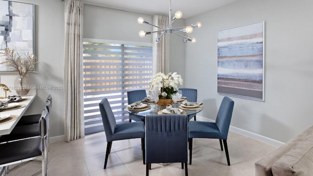 tiled dining space featuring a notable chandelier