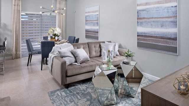 tiled living room featuring an inviting chandelier