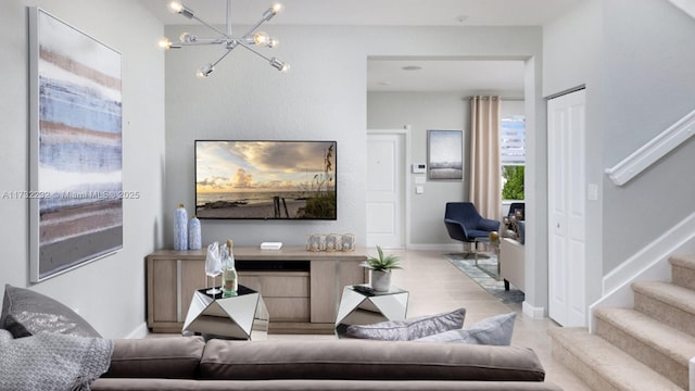 living room featuring light tile patterned flooring and an inviting chandelier